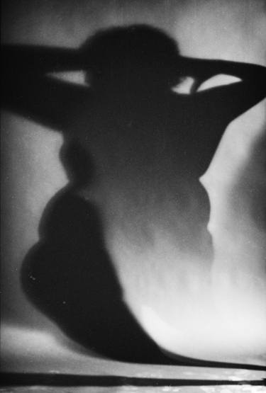Surrealist silhouette of fat woman black and white film silver gelatin analog photographic studio portrait photo thumb