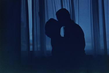 Blue silhouette couple kissing analogue film photograph thumb