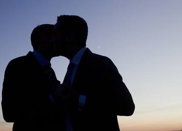 LGBT gay wedding marriage grooms kiss silhouette wedding photo thumb