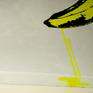 Image shows yeloow drips running onto bottom of canvas.