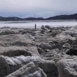 Figure on Ice Chunks, Nunavut, from Thaw: A Changing Arctic by Larry Cwik