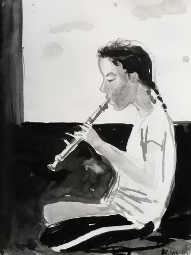 Young girl playing flute. thumb
