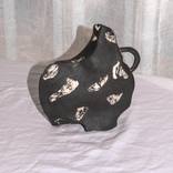 Black wavy vessel by Calila Baca