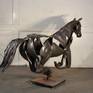 This work is by commission only and requires 2-3 months to make. 
This sculpture portraits the graceful energy of a horse galloping, frozen at the moment where one foot is on the ground and all others are in the air. This is a handmade, hammered and welded stainless steel sculpture.