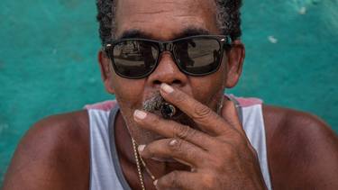 Man smoke a cigar next to Tobacco Farm in Vinales Cuba South America - Limited Edition of 100 thumb