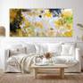 yellow abstract painting above sofa