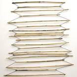 Hanging bamboo sticks by Nico Kok