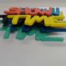 layered text
showtime
multicolor
framed in box/ plexiglass front