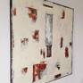 The Ivory-Copper Monolith (left) hanging on the wall