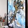 The artwork framed on the worktable, with paint and brushes nearby to indicate scale.