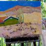 the artwork on the easel in the studio