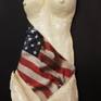 Clay sculpture nude from a woman with the American flag