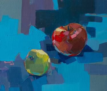 two apples on blue thumb