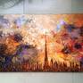 This cityscape of Dubai came about after a lot of experimentation with knife painting and pure color. It has the skyline done in gold liner and filled in with glass paint, so that there are various textures with gloss and matt.