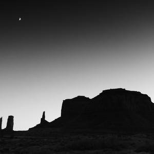 Crescent Moon over Monument Valley Buttes at Dusk