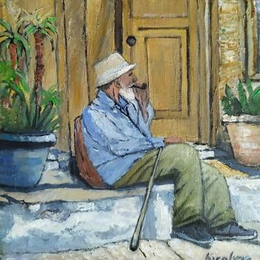 An old man with a pipe thumb