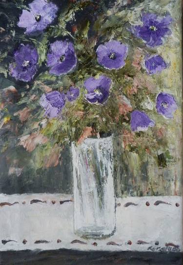 Petunias in a glass vase thumb