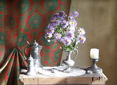 A still life with autumn flowers and a candle thumb