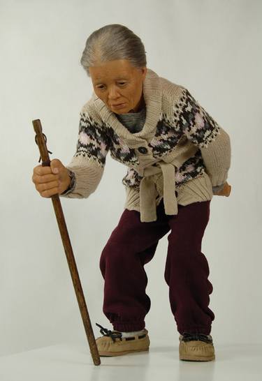 Old lady with a walking stick thumb
