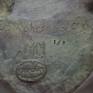 Stamp guaranteeing the origin, quality, number of exemplars, artist