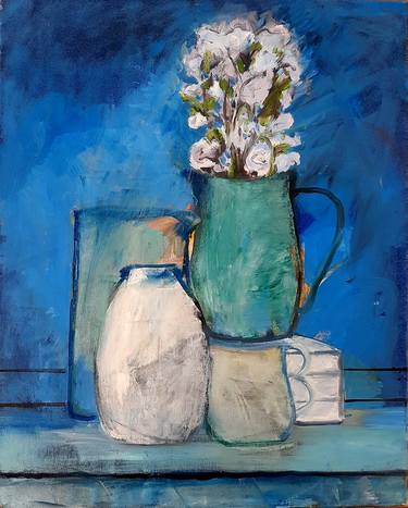 Vases and white flowers on blue thumb