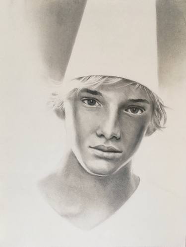 Boy with a white pointed hat thumb