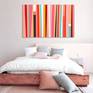 Pink and peach abstract painting in interior.
