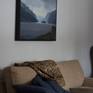 Framed above couch.