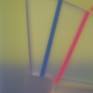 The core element in Kal Mansur’s work is a sculptural object he calls “fodder”. This shape is made of completely clear and hard-edged plexiglass. Mansur embeds fluorescent pigments into it which project through the edges. He paints surrounding areas and encases the work within a translucent panel. The completed piece appears to change as light strikes its internal elements, enabling the viewer to visually travel through the composition.
