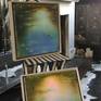 An original oil painting.  Reflections of evening light on a still waterlily pond.
Framed in a wooded box floating frame, hand painted.