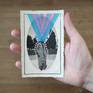 View from above, unframed with hand. 