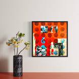 red wall with paintings by Barbara Scott