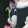 Detail of the right hand holding a tulip.