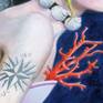 Detail of the coral brunch and the tattoo.