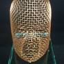 A copper mesh face, fastened with copper wire from a glass base. All my work combines the mesh ...