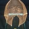 A copper mesh face, fastened with copper wire from a glass base. All my work combines the mesh ...
