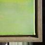 The picture sits within a simple wooden floating frame.