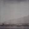 Other Desert Cities (Sidewinder) - 2005

160x175cm, Edition 1/5, 13 piece, 48x46cm each.
Analog C-Print, hand printed by the artist,  based on 13 Polaroids.
Signature label and Certificate.
Artist Inventory No. 3432A. 
Not mounted. 

2005  SIDEWINDER - Director / Artist  / Camera / Editing - starring JD Rudometkin, Stefanie Schneider, music by JD Rudometkin

private history turned into an intimate mythology of elemental fantasies where reality is perceived through a veil of psychedelic memories and unconscious projections. such is a collection of passions and dreams, an uncanny diary of ephemeral narratives and mental intensities in Stefanie Schneider’s painterly photographs where subjectivity of an ontological doubt uses a poetics of pastische as a vehicle for an intertextual journey towards the truth and the authenticity of primary emotions. here time is immersed in a nostalgic suspense of oneiric dimension, a sort of ambiguous coma of silence and comfort, and open space embraces a psychotic landscape of solitude and accidental pleasure. fetishisized surface of extreme feelings gives a stage for an unsolicited promise of unconditional love and unlimited freedom, a promise framed by sensual tension between fulfillment and expectation. (Adam Budak, Kunsthaus Graz, Oct 2005)

Sidewinder
There’s blood on the dress that hangs in the Airstream trailer outside 29 palms. With the pistol in her sweat palm touching at his temple. Tell me what god’s gonna do for me and you now Stevie’s saying while Brother John Baptiste looks there across to where her cat seems weak and fed. All the good that comes to me from my believing man, I wanna hear about it said to me like that. Just the way you breathed it like you did 10 minutes ago when I was wrapped so well around your head. Silence then. A baby screams his mother out in the dessert night who wakes so late. Orion is a belt John Baptiste looks at through the torn-screen trailer window. There, touching his calf are vipers crawling now across her feet between his knees in front of her he kneeling for his life and they are full of venom with their broken fangs.

A gun at head, where even his breath, so short, is preaching. He’s in a wheat field. John Baptiste. Counting birds on telephone wires hung low in afternoon where his mother’s call cannot now reach him. There she stands a weeping willow with the sidewinder underneath the trailer step a drop of blood upon her ankle with the bullet through its head. A scar follows sweat palm to wrist. Torn Stevie. Scars from the weapon to her toes an accidental act of God her father said. On Vaness at California 16 years ago but who’s counting 6 bullets for the barrel wait beside the temple. The long white shaft of tissue hemmed together gods tattoo along her ribs, hip to breast. She wants to fuck the preacher in her trailer with his bible on the alter front row Stevie asks forgiveness holy father from the car that shook her bones apart. John Baptiste asks to pray before she leads his temple head.

For twenty minutes darkness hides the accidents in trailer shade her childish screams a preacher underneath her shimmer blue bled dress. The prayers he said beside the bed with mother for relatives with tumors, brand new bicycles, and rain. Stevie takes the whisky in her mouth to wash him out the sidewinder skids across her wounded foot of scars. John Baptiste asks the Lord to heal her in the new day that is breaking mouth of whisky spits it laughing father forgive the trigger finger for the viper he gives thanks.

And takes the barrel toward his lips through mumbling supplication kiss it Brother Stevie offers, please, but doesn’t wait him there. Copper penny Sunday School upon the tongue. And closed his eyes. A blur of her and mother. Other bodies. Women, gently crushing spirits. Prayers. His han under her weight in grams. The fingernail fang and fucks it. So slid the pull of metal out As god can answer. And into her mouth then. Settles. And wet the metal. He touches her, his finger. Viper like. And fuck it sore. Believers. Repentant whore forgiven preacher leaving town in that old ragtop down and left a rag dress bleeding in the Airstream soft, again. (JD Rudometkin)

“Working on Sidewinder with Stefanie Schneider was intense. It is a very personal piece for both of us, though I feel in very different ways. When overdue fears and aspirations are able to surface in a project, the work becomes a mirror. Such efforts are always a risk. I am still uncertain of what exactly to make of it Sidewinder. How much should have been exposed. What needs to remain sacred. I almost did not drive that „68 Deville” out to 29 Palms on the day we were set to shoot. I followed her out there against a feeling I had. Was it fear? I don’t know. Perhaps mistakes do not exist. What is our intuition composed of anyhow? When I look out across the desert, it seems so flat. So free of dramatic lines. That is when a human figure appears, even in the distance, a curiosity. There are so many of us clustered in these cities, who would care. Why take the time? I will always drive out of town back into parts of Sidewinder from time to time.”(JD Rudometkin)

------

In the case of Sidewinder the scenario was created by internet where she met J.D. Rudometkin, an ex-theologian, who agreed to her idea to live with her for five weeks in the scrubland desert
environment of Southern California. The dynamics and unfolding of their relationship, both sexually and emotionally, became the primary subject matter of this series of photographs. The relative isolation and their close proximity, the interactive tensions, conflicts and submissions, are thus recorded to reveal the day-to-day evolution of their relationship. That a time limit was set on this relation-based experiment was not the least important aspect of the project. The text and music accompanying the DVD were written by the American Rudometkin, who speaks poetically of “Torn Stevie. Scars from the weapon to her toes an accidental act of God her father said. On Vaness at California.” The mix of hip reverie and fantasy-based language of his text, echoes the chaotic unfolding of their daily life in this period, and is evident in the almost sun-bleached Polaroid images like Whiskey Dance, where the two abandon themselves to the frenetic circumstances of the moment. Thus Sidewinder, a euphemism for both a missile and a rattlesnake, hints at the libidinal and emotional dangers that were risked by Schneider and Rudometkin. Perhaps, more than any other of her photo-novels it was the most spontaneous and immediate, since Schneider’s direct participation mitigated against and narrowed down the space between her life and the art work. The explicit and direct character of their relationship at this time, opens up the question as to the biographical role Schneider plays in all her work. She both makes and directs the work while simultaneously dwelling within the artistic processes as they unfold. Hence she is both author and character, conceiving the frame within which things will take place, and yet still subject to the same unpredictable outcomes that emerge in the process.

(Mark Gisbourne, Stranger than Paradise, 2006, page 12-14)