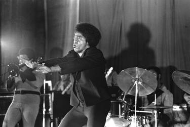 James Brown arms out on stage at Rikers Island thumb