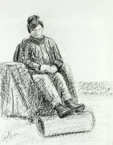 Woman sitting with her legs on a rol thumb
