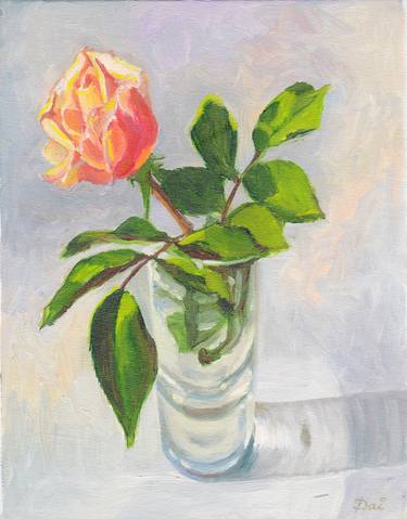 Oil painting of a pink and yellow rosebud in a glass vase thumb