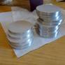 Some of the aluminum disks used for the artwork.