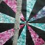 A geometrical abstract which represents the explosion of a star in space releasing various colours and gases as it explodes into its conscience.