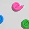 Polymer clay shaped into swirls and curves with stainless steel screws at the end of the swirl. It is inspired from the contrasting effect between the softness at its birth and sharp and hard ending.
The artwork comes framed in a white wooden frame, ready to hang.