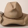Carved out of a solid block of buff colored limestone.  The iconic Cowboy Hat;  I created this replica as part of my "What is American" series in 2010. Though I  am a second-generation American whose family has no roots in the West, I felt that this hat symbolizes an important part what can be called Americana