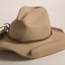 Carved out of a solid block of buff colored limestone.  The iconic Cowboy Hat;  I created this replica as part of my "What is American" series in 2010. Though I  am a second-generation American whose family has no roots in the West, I felt that this hat symbolizes an important part what can be called Americana