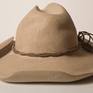 Carved out of a solid block of buff colored limestone.  The iconic Cowboy Hat;  I created this replica as part of my "What is American" series in 2010. Though I  am a second-generation American whose family has no roots in the West, I felt that this hat symbolizes an important part what can be called Americana