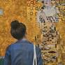 Woman watching the famous painting of gustav klimt in the museum

Watching Klimt Woman in Gold Portrait of Adele Bloch-Bauer I