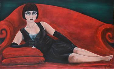 Girl laying on a red sofa thumb