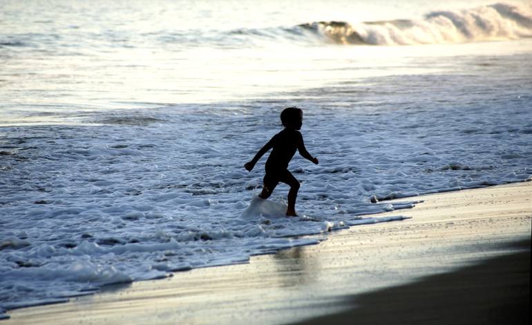 A girl running on the beach - Print
